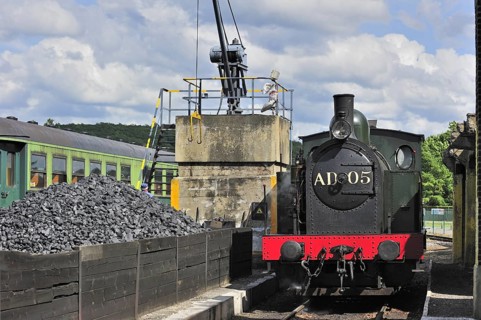 Crane loading coal as fuel for steam train at the depot of the Chemin de Fer a Vapeur des Trois Vallees at Mariembourg
