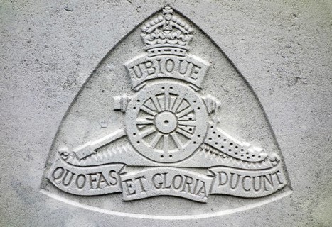 Royal Field Artillery regimental badge on headstone at Cemetery of the Commonwealth War Graves Commission for First World War One British soldiers