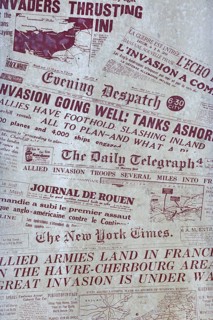 Memorial stone with frontpages of newspapers during D-Day at the Juno Beach Centre at Courseulles-sur-Mer