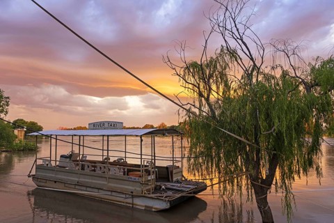 River taxi boat on the Orange river at sunset near Upington