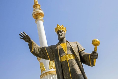 Statue of Turkmen leader in front of the Independence Monument