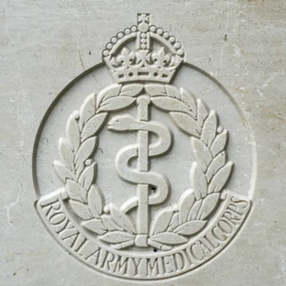 Royal Army Medical Corps regimental badge on headstone at Cemetery of the Commonwealth War Graves Commission for First World War One British soldiers