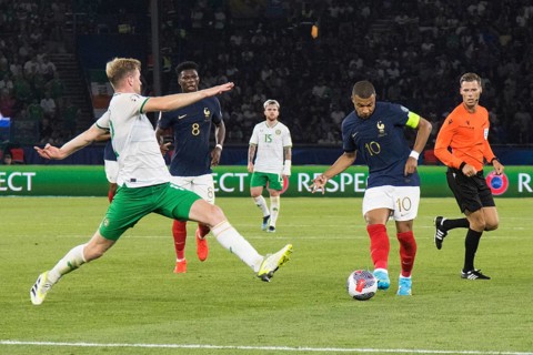Nathan COLLINS Ireland left tries to stop Kylian MBAPPE France