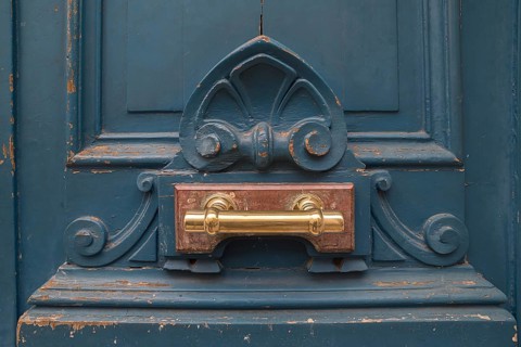 Brass door handle on an old front door
