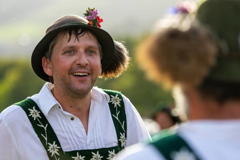Alpine herdsman in traditional traditional costume