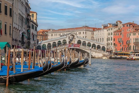 Grand Canal with Rialto Bridge and Pier with Gondolas
