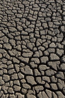 Abstract pattern of dry cracked clay mud in dried up lake bed