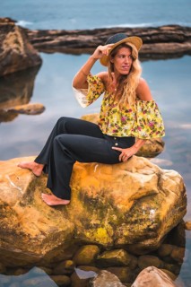 Caucasian blonde girl in a floral shirt