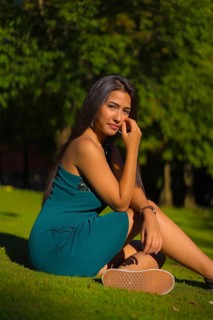 A pretty young brunette Latina with long straight hair