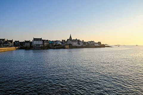 Old town with buildings and church tower by the sea