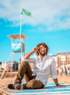 Summer lifestyle with a young dark-haired Caucasian man with long beard