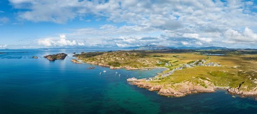 Aerial panorama of the coastline of the Ross of Mull peninsula with the fishing village of Fionnphort