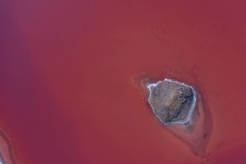 Aerial view of a salt works with salt island