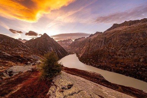 Autumn evening mood at Grimselsee in the Swiss Alps with Zinggenstock
