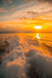 The Ceiba ferry heading to Roatan Island at sunset. Honduras