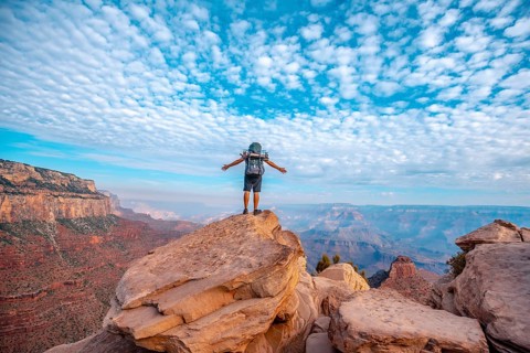 A young man on a viewpoint of the descent of the South Kaibab Trailhead. Grand Canyon
