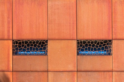Window in a metal facade of a restaurant
