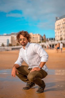 Summer lifestyle with a young dark-haired Caucasian man with long beard
