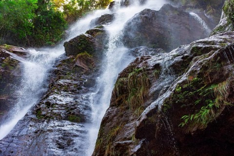 Stunning waterfal through the rocks and forest in Minas Gerais