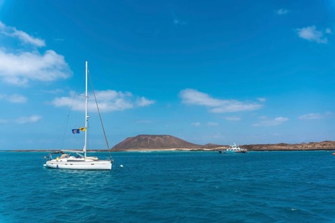 Boats in turquoise water on Isla de Lobos