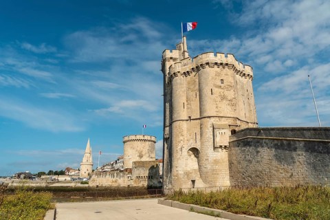 The beautiful fort and Saint Nicolas Tower of La Rochelle in summer. Coastal town in southwestern France