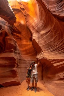 A couple admiring the beauty of the Upper Antelope Canyon in the town of Page