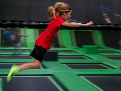 Young boy jumping and playing
