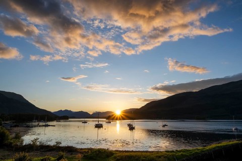 Sunset over the freshwater loch Loch Leven