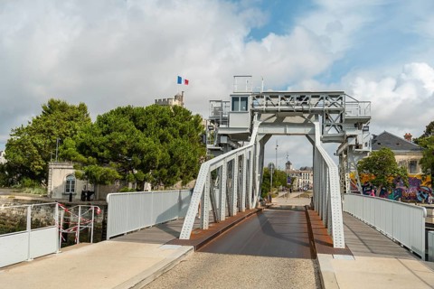 A bridge in the marina next to the towers of the fort in La Rochelle. Eastern france
