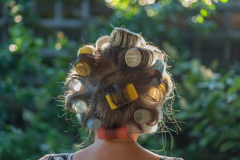 Woman's head from behind with curlers