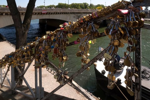 Love locks on a staircase to the Seine