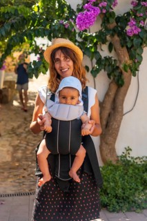 A mother walking with her baby in Sa Tuna on the coast of Begur in summer