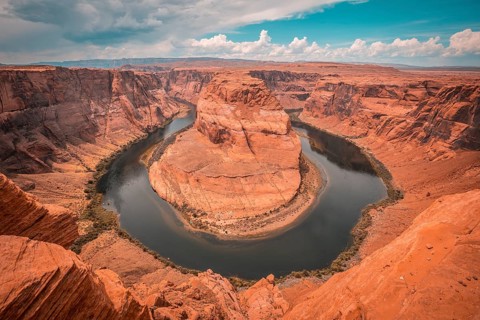 The stunning Horseshoe Bend and the Colorado River in the background with retouching Orange Teal