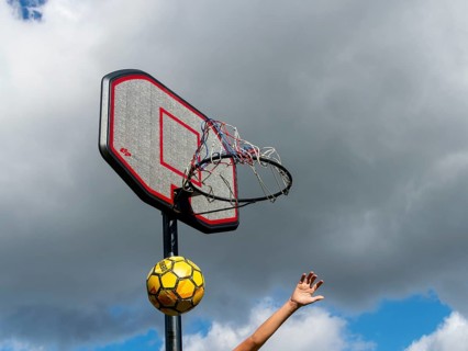 Basketball Jumping with the ball to the basket and net