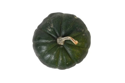 Top view of dark 'Black Kat F1' acorn squash with dark green