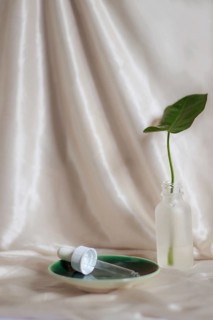A green leaf in a glass dropper bottle