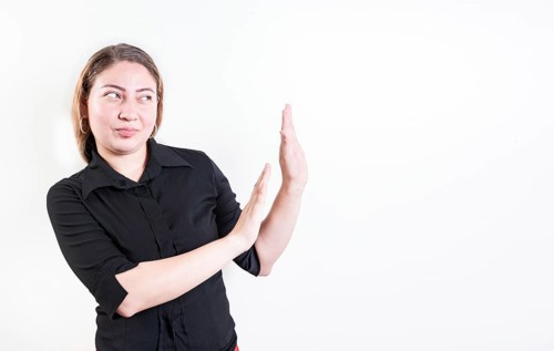 Displeased young woman rejecting with palms hands isolated. Disgusted young woman with rejection gesture. He frowns in disgust