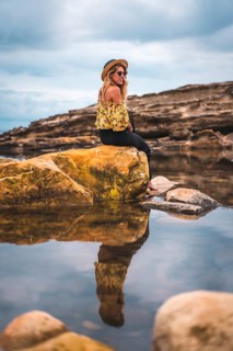 Caucasian blonde girl in a floral shirt