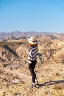 A young hiker in the desert canyon of Tabernas