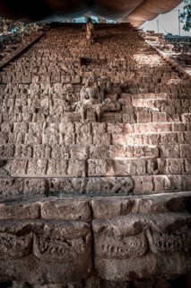 A Mayan figure on the stairs of the Copan Ruinas temples. Honduras