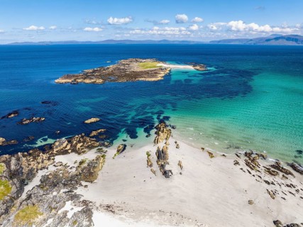 Aerial view of the sandy White Strand of the Monks on the northern part of the Isle of Iona