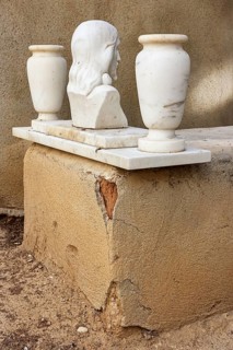 Simple grave with crumbling plaster