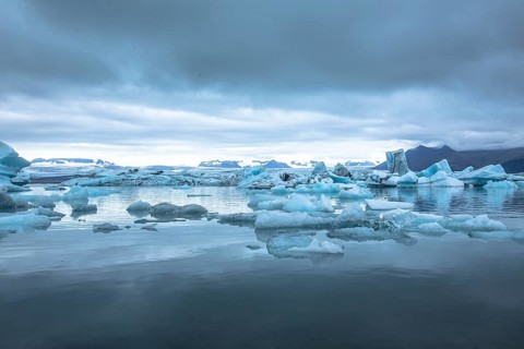 Beautiful icebergs on Jokulsarlon Ice Lake in the golden circle of southern Iceland on a cold August morning