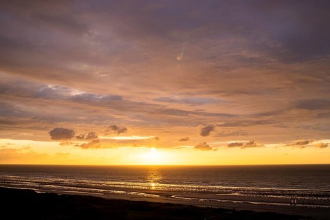 Sunset on the beach of De Panne