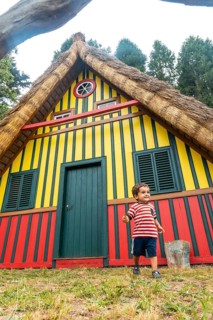 Playing in a traditional Madeiran house like those of Santana in the forest of Caldeirao Verde