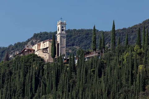 Church on a hill with cypresses