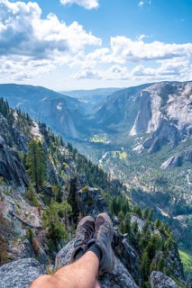Sitting winged from Taft point looking at Yosemite National Park and El Capitan. United States