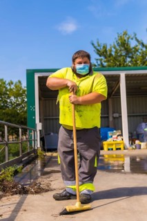 Worker in a recycling factory or clean point and garbage with a face mask and with security protections