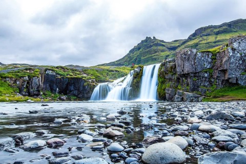 The famous Icelandic mountain Kirkjufell and the small waterfalls