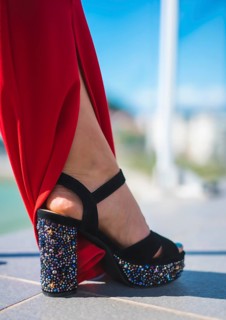 Detail of high-heeled shoes decorated with pearls